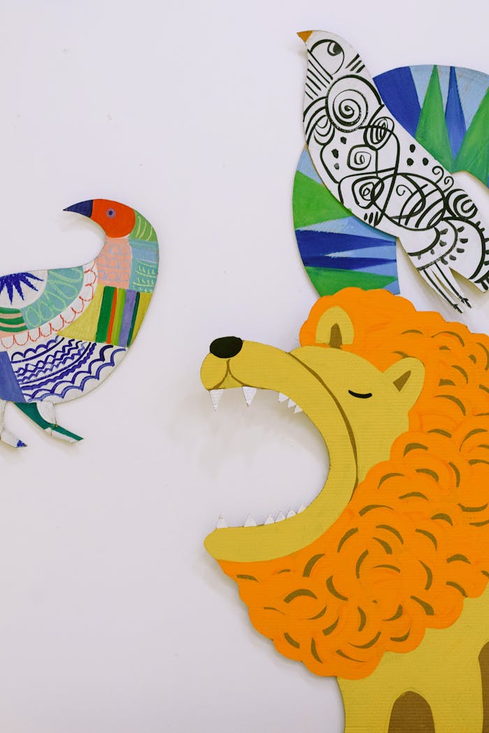 Home Vibrant paper cutouts of a lion and birds in artistic design.